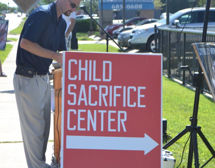 child sacrifice center sign
